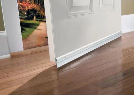 Door sweep fitted to a white exterior door